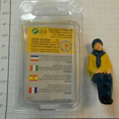 Online Elita Modelle 10060 Man Siting With Yellow Coat And Blue Scarf - Your Source for Gaming Essentials Trains